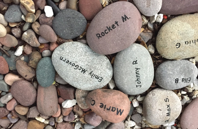 names engraved in rocks in memory garden